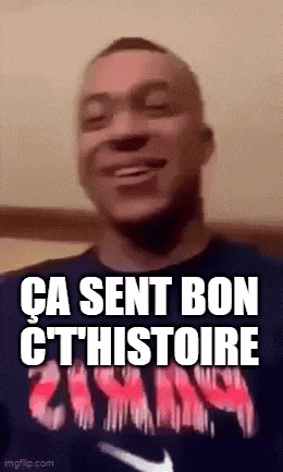 a man is smiling and wearing a blue shirt with the words `` ca sent bon cthistoire '' written on it .