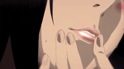 a close up of a woman 's mouth with a tear coming out of her eye