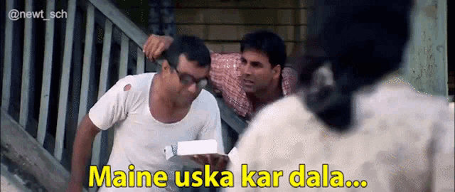 a man holding a box with the words maine uska kar dala in yellow letters