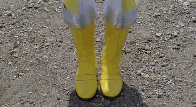 a blurry picture of a person in a yellow and white costume