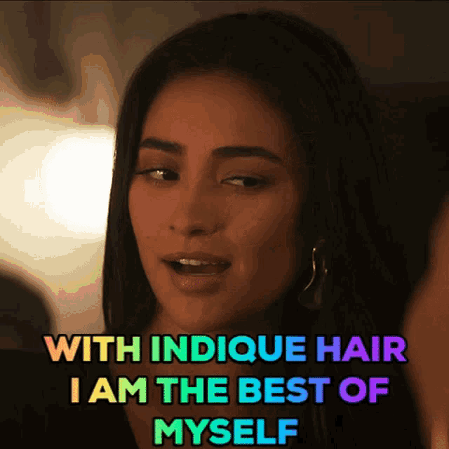 a woman says with indicque hair i am the best of myself in a rainbow colored text