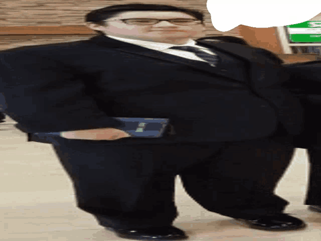 a man in a suit and tie is holding a book that says ' bible ' on it