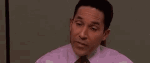 michael scott from the office says `` i 'll be six '' while sitting at a table .