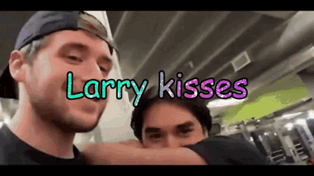 larry kisses is written in purple letters on a video