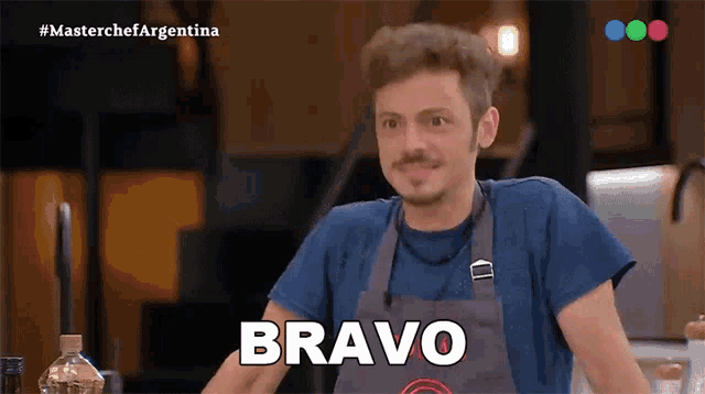 a man wearing an apron says bravo on a television screen
