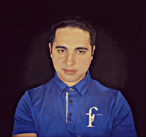 a man in a blue shirt with the letter f on the front