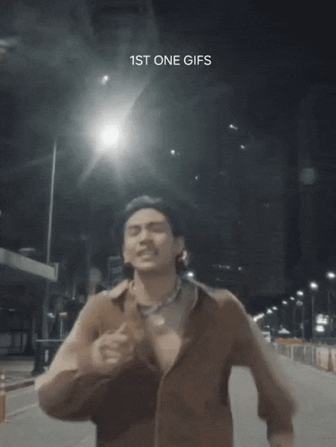 a man is running down a street with the words 1st one gifs on the bottom