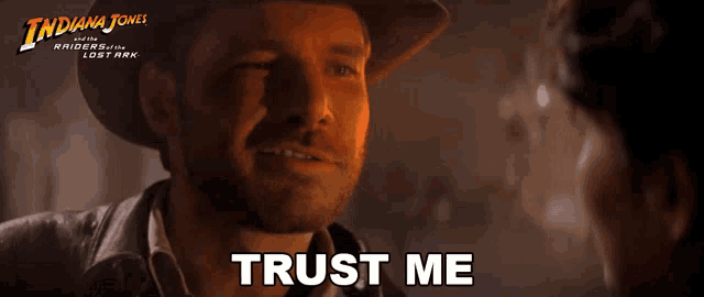 a poster for indiana jones shows a man in a hat