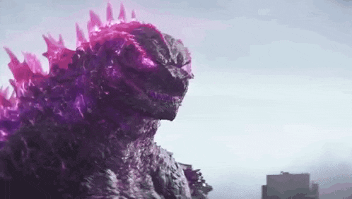 a close up of a purple godzilla with purple eyes standing in front of a building .