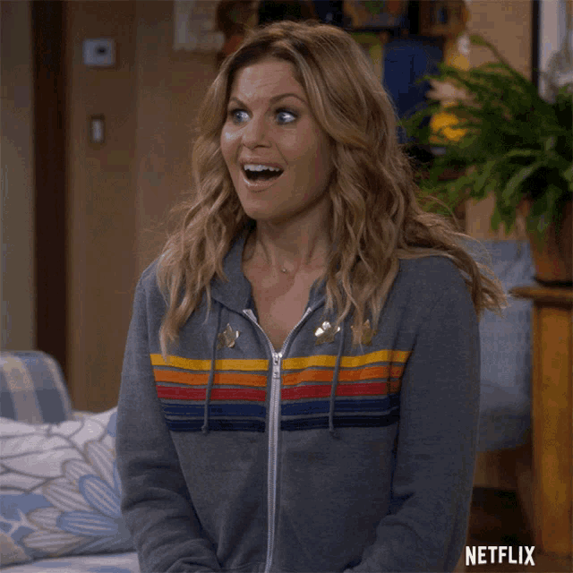 a woman with a surprised look on her face is wearing a netflix advertisement