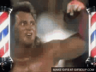 a gif of a man standing in front of a barber pole with the words make gifs at gifsoup.com