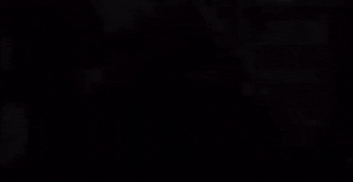 a blurry picture of a man wearing headphones and a mask .