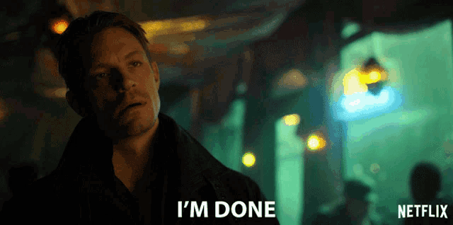 a man says i 'm done in front of a netflix sign