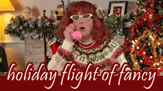 a woman wearing a sweater that says it 's snowball is talking on a pink phone .
