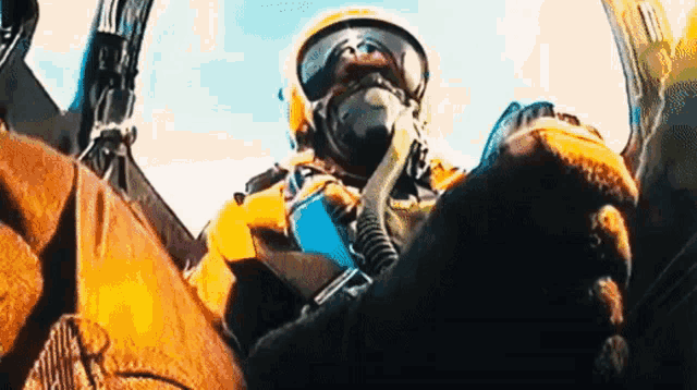 a close up of a person wearing a helmet and goggles .
