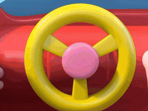 a yellow toy steering wheel with a pink circle in the middle