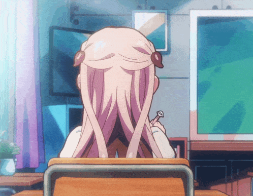 a girl with long pink hair is sitting in a chair