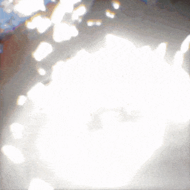 a white background with a few spots of light coming out of it