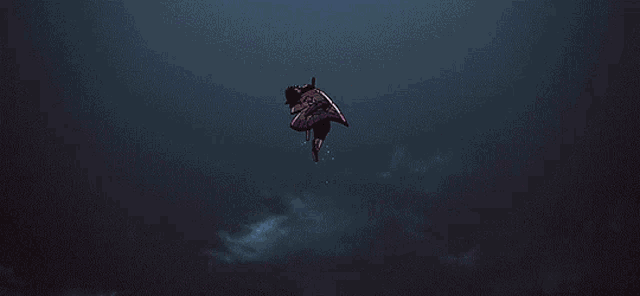 a girl in a butterfly costume is flying through the air with her hand out .