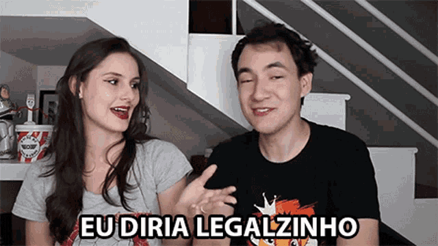 a man and a woman are standing next to each other with eu diria legalzinho written in the corner