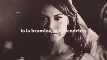 a black and white photo of a woman wearing a mask that says lo lo bromios