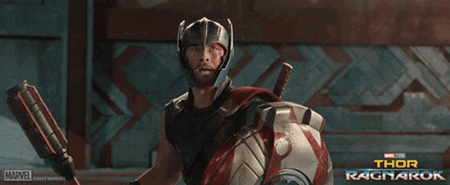 a movie poster for thor ragnarok shows a man in armor