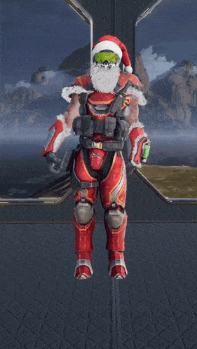 a man with a santa hat and beard is sitting on the ground