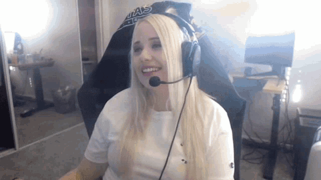 a woman wearing headphones and a shirt that says ua's