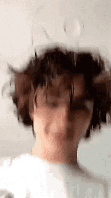 a close up of a person 's face with a white hat on .