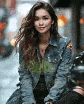 a woman wearing a denim jacket with a patch that says ' army ' on it