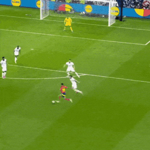 a soccer game is being played in front of a sign that says ' lidl ' on it