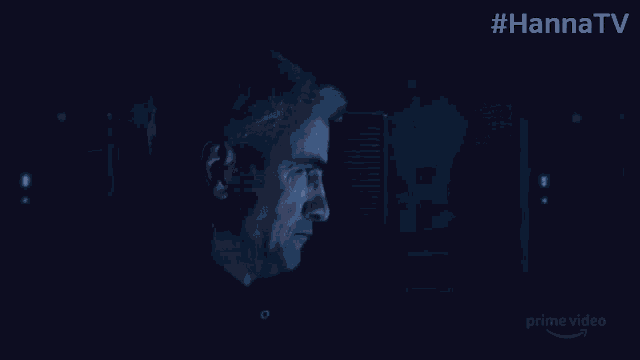 a man is looking at a screen with the hashtag #hannatv on it