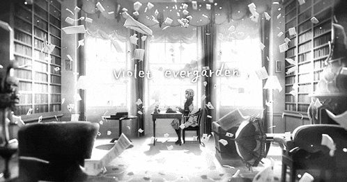 a black and white photo of a woman sitting at a desk in a room surrounded by bookshelves .