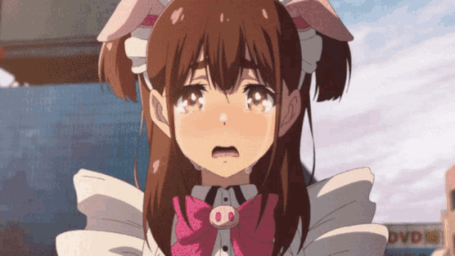 a girl in a maid outfit is crying in front of a sign that says dvd