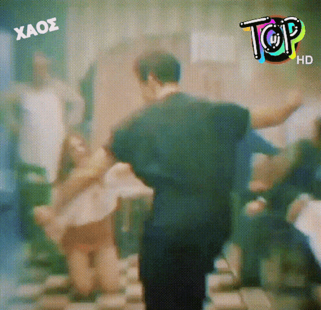 a blurry picture of people dancing with the words top hd on the bottom left