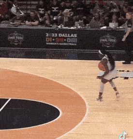 a women 's basketball game is being played at dallas