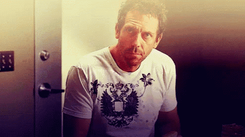 a man wearing a white t-shirt with an eagle on it