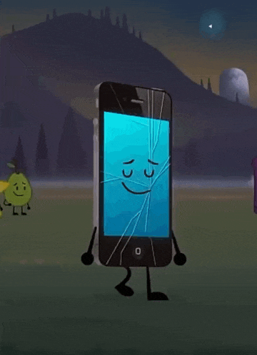 a cell phone with a cracked screen is standing in a field .