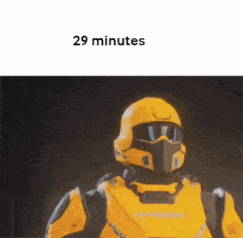 a yellow robot wearing a helmet and goggles with the words 29 minutes written on the bottom
