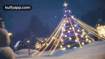 a christmas tree with a star on top of it is in the snow .
