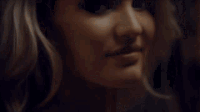a victoria 's secret ad features three women in white lingerie