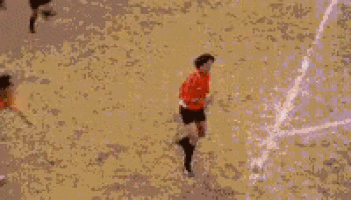 a soccer goalie is diving to block a shot while a player in a yellow jersey with the number 8 on it watches
