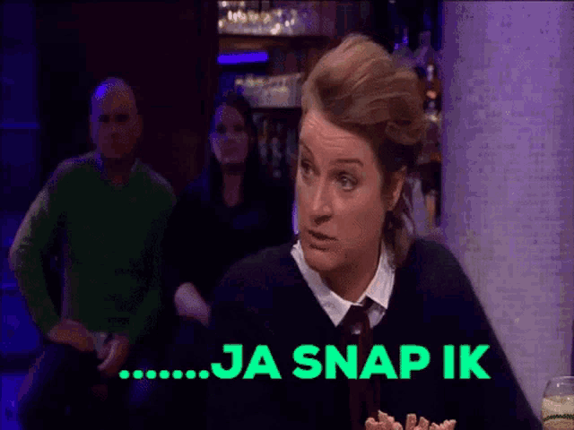 a woman sitting at a table with ja snap ik written on the bottom