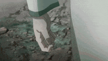 a close up of a person 's fist with a spider web on it