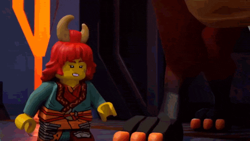 a lego ninjago character with red hair and horns is holding a blue object .