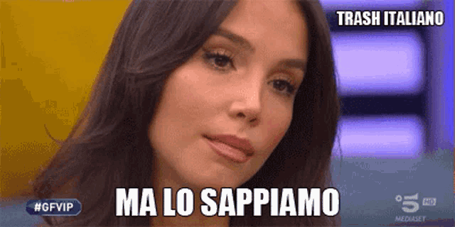 a close up of a woman 's face with the words " ma lo sappiamo " on the bottom