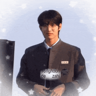 a young man wearing glasses and a name tag with the name yonghoon de zahi on it