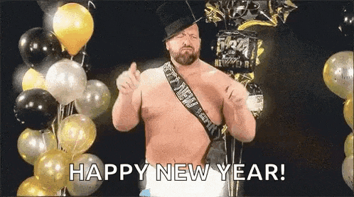 a shirtless man in a top hat is standing in front of balloons and giving a thumbs up .