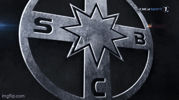 a compass with the letters s b and c in a circle