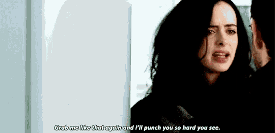 a woman is talking to a man and says `` grab me like that again and i 'll punch you so hard you see .
